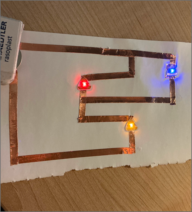 A circuit lit with three-colored LEDs.