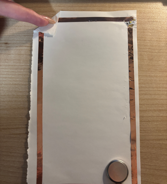 Testing a circuit by pressing down on the battery.