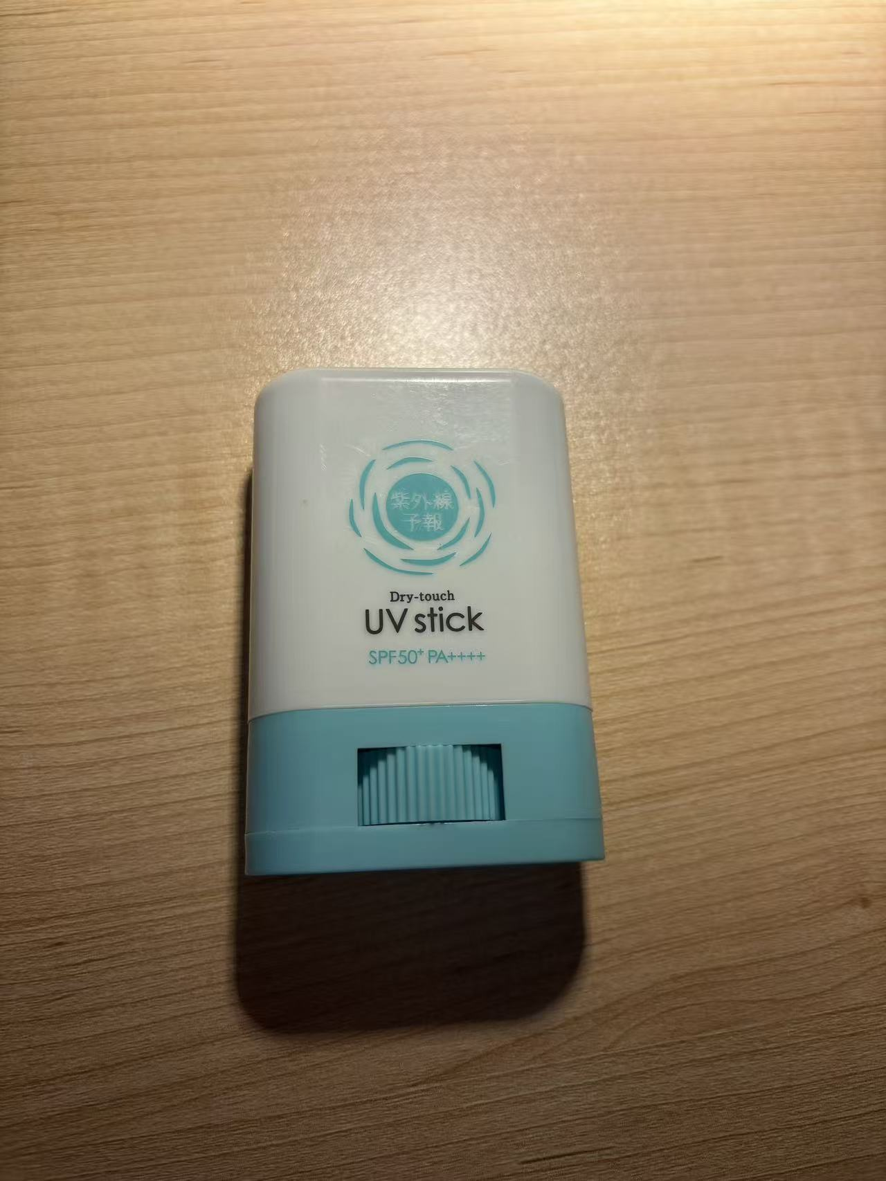 A twist-up sunscreen stick showing the retractable core.