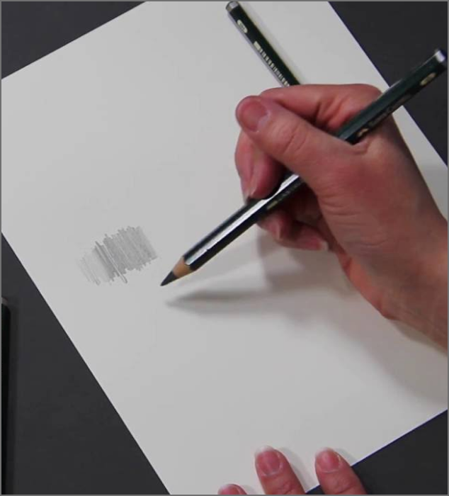 A scene of a hand holding a pencil to draw.