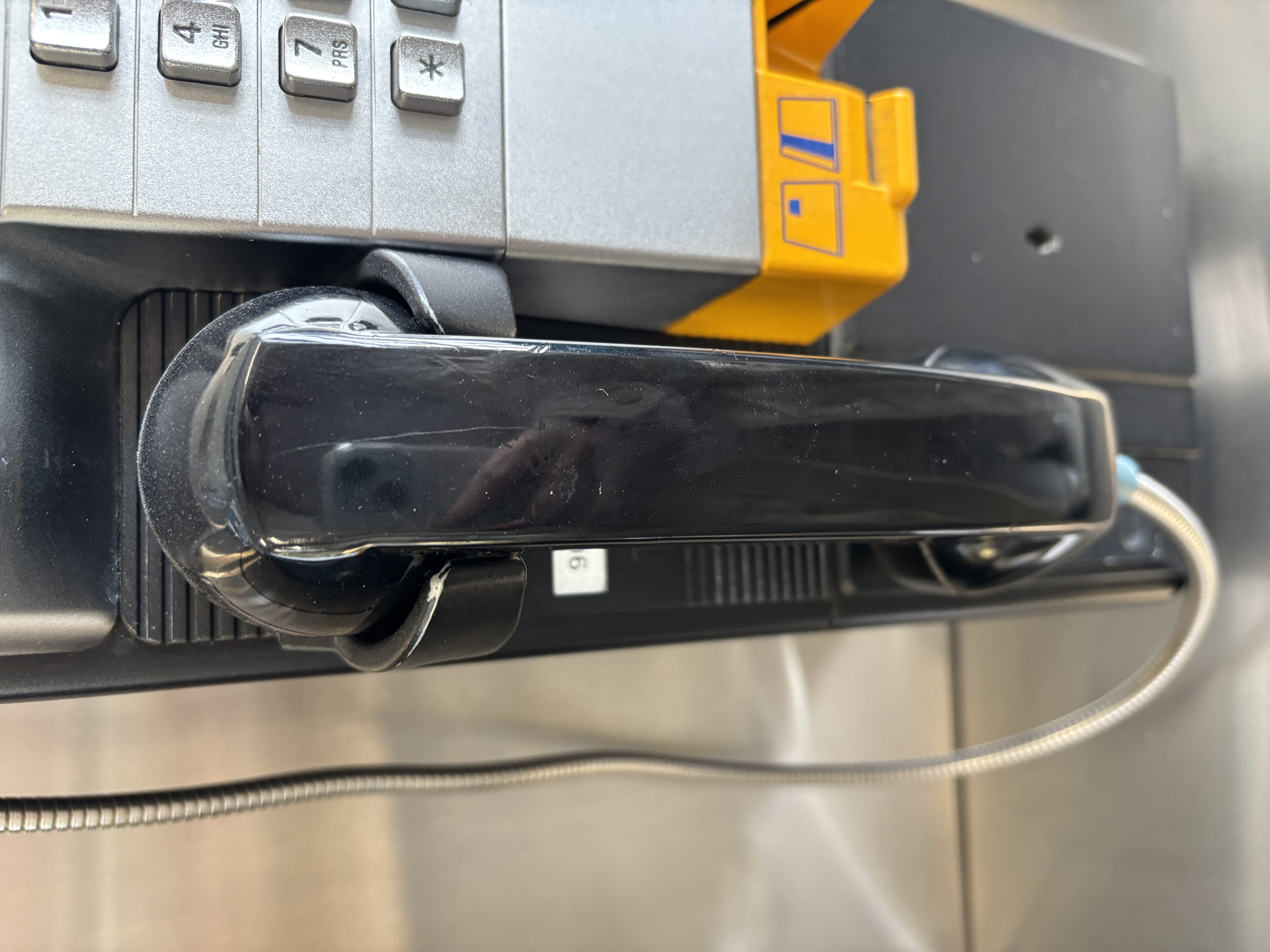 Telephone receiver that makes a clattering sound when picked up or put down.