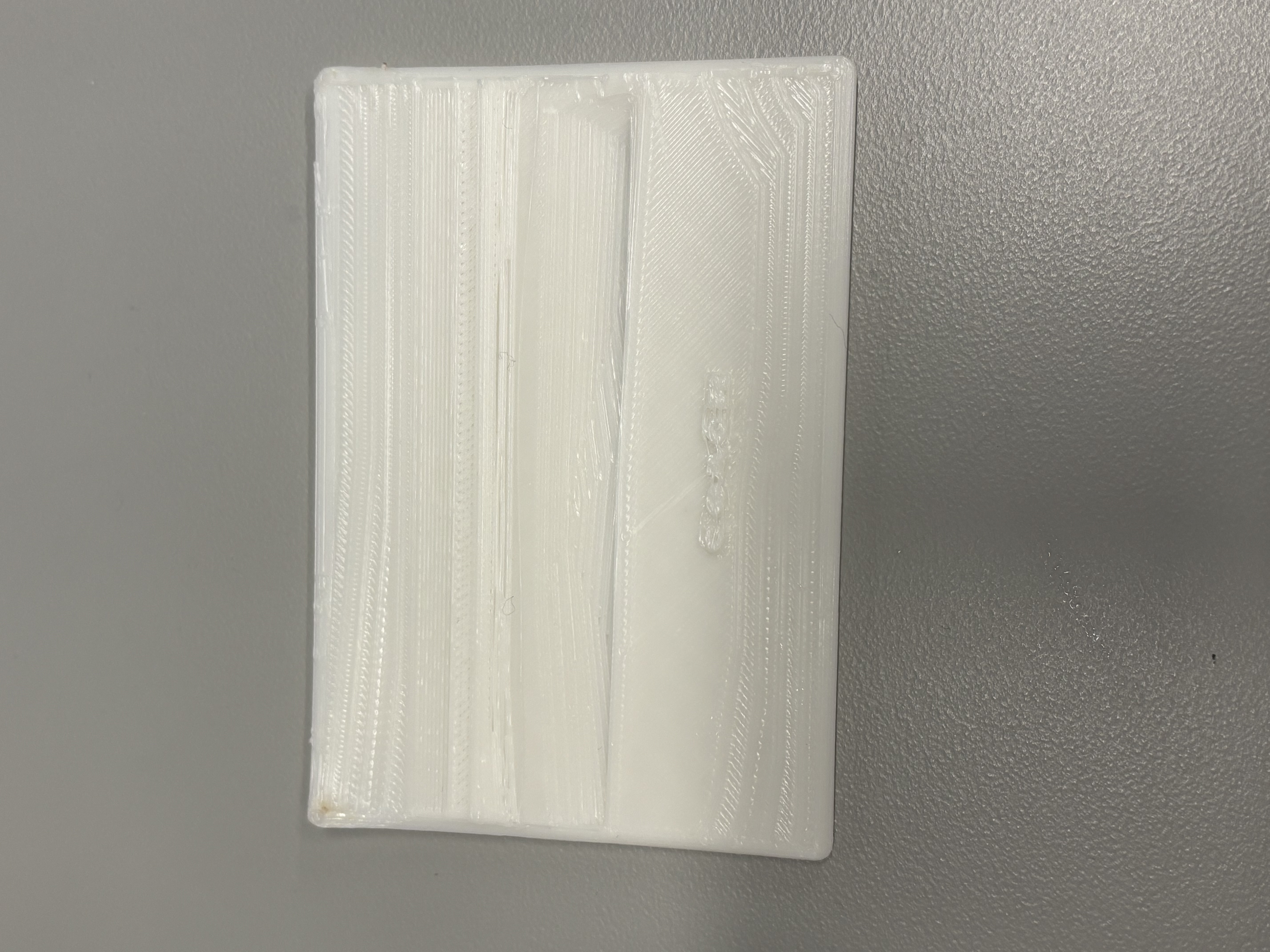 Wood-look birdhouse crafted from stoneware clay using salt-fired techniques.