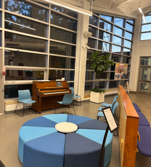 The scene depicted in the photo is near the windows and doors of the SSU building at Sheridan College.